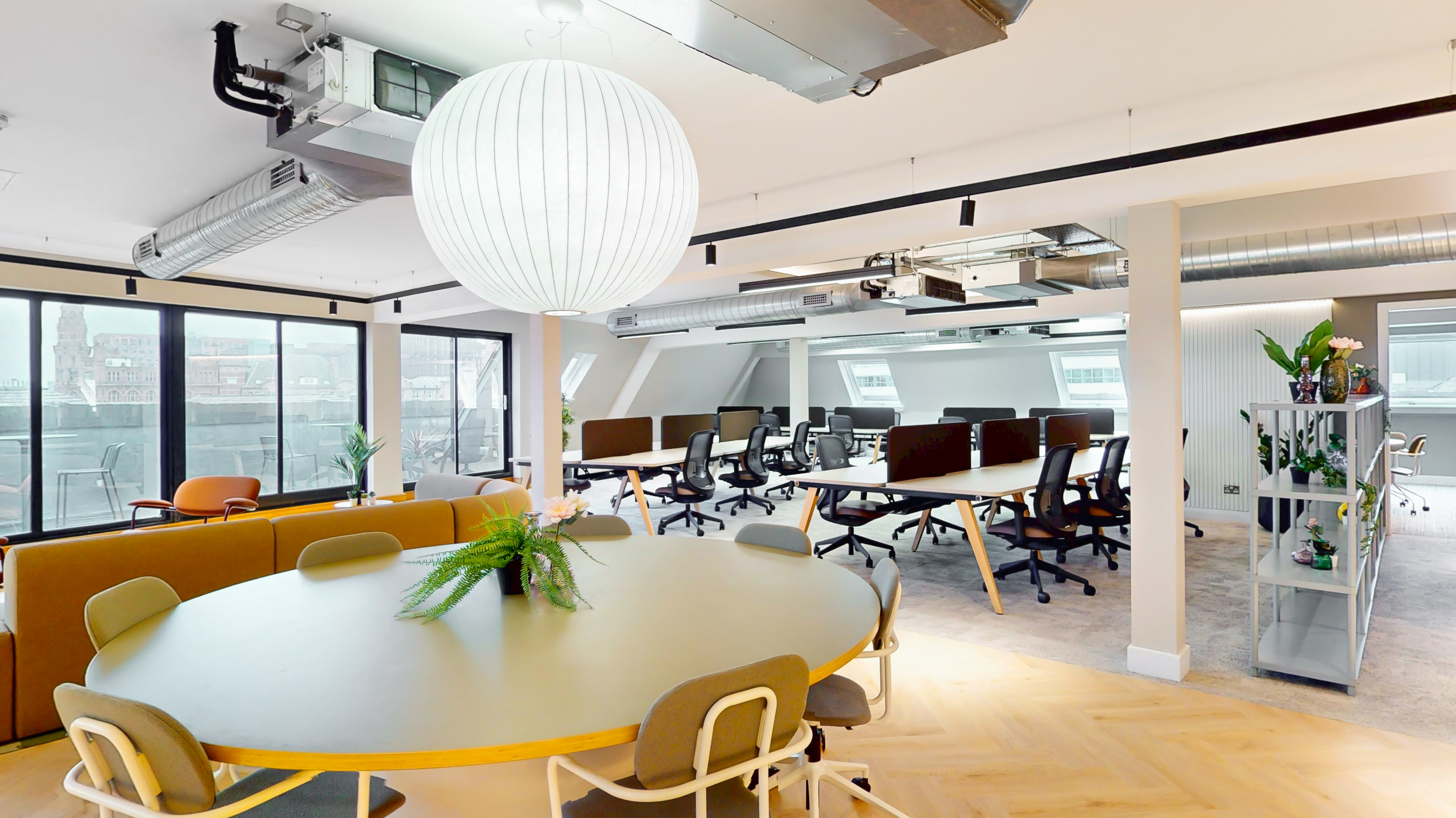 An entire private fitted floor at 101 Princess Street — open-plan workspace with restored heritage windows