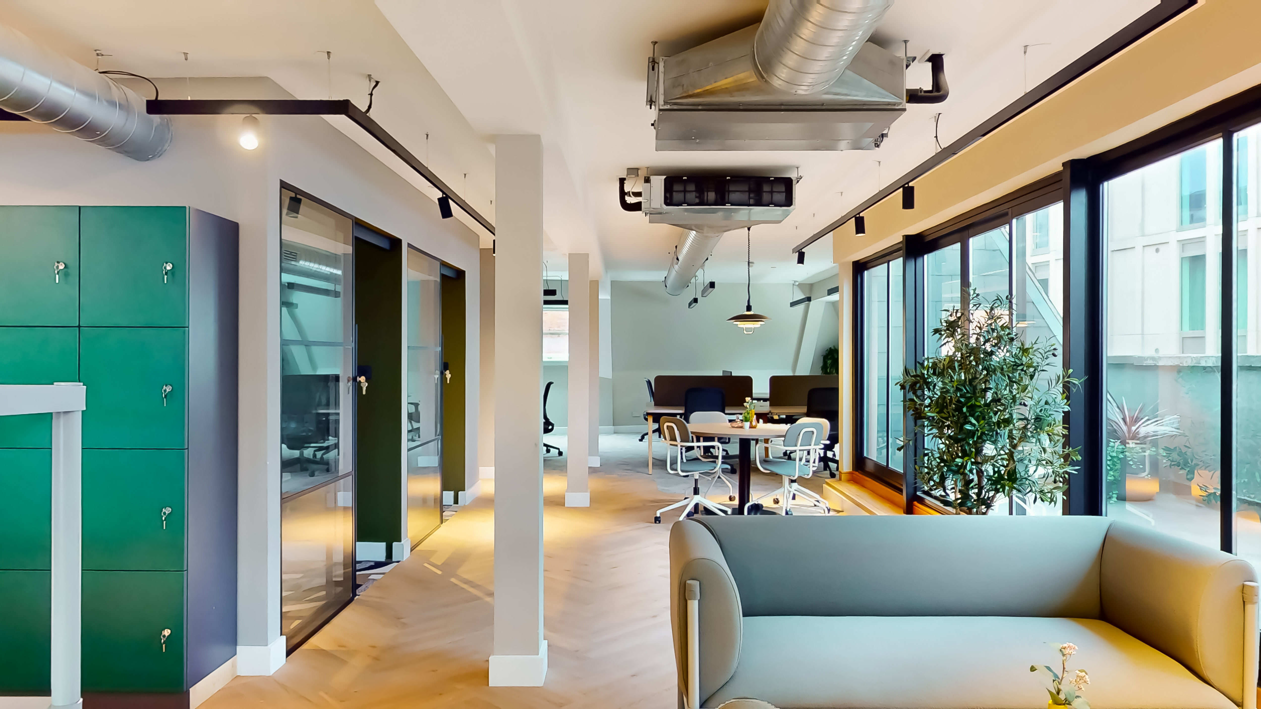 5th floor interior — lounge, lockers and city-view window