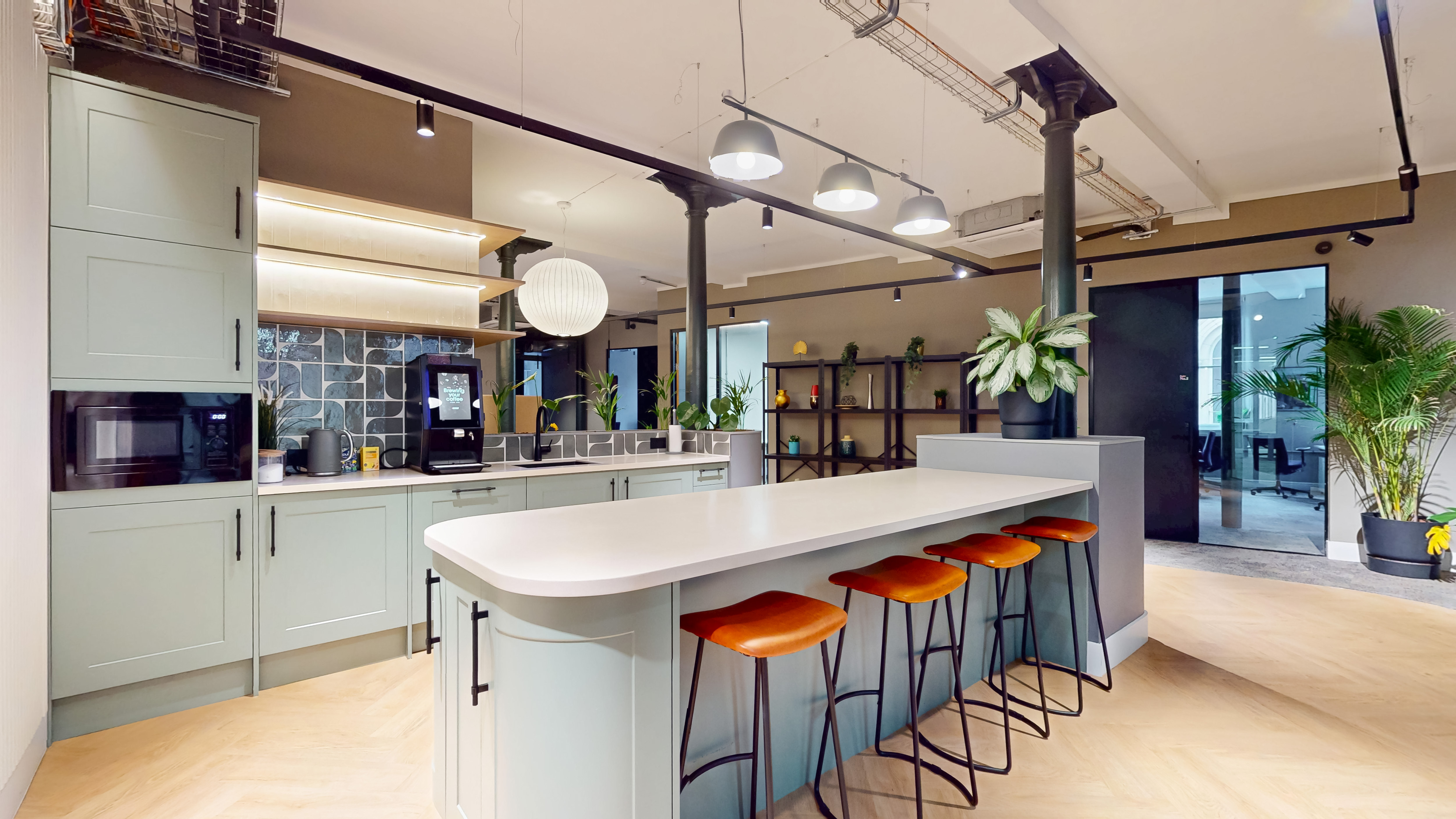 Newly designed kitchen and bar with island seating
